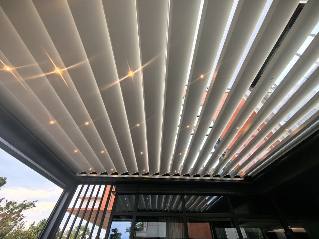 louvered pergola with built-in lighting